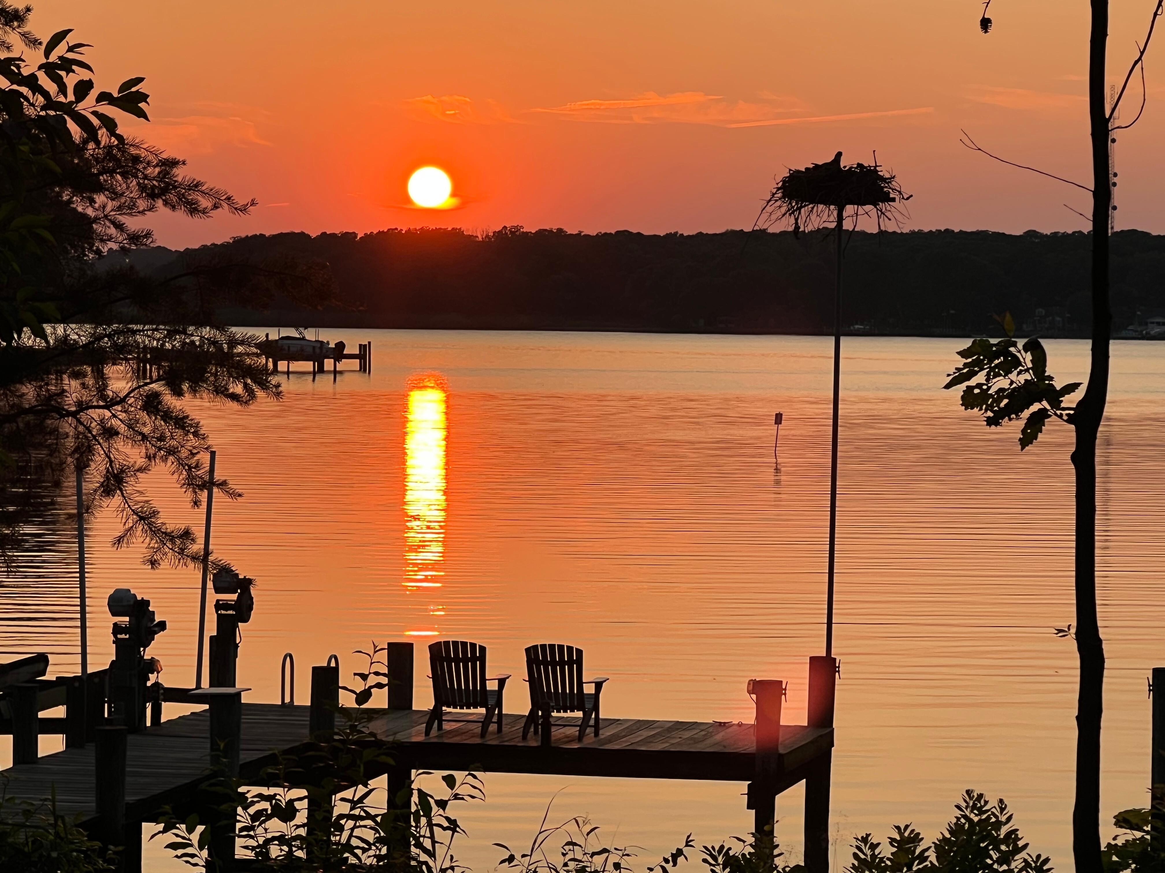 Sunset with osprey nest in the foreground 