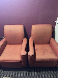 Burnt and stained chairs. Along with greasy stained walls.