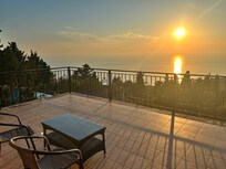Sunset view from upstairs balcony off bedroom