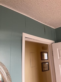 Door frame showing general disrepair of the house.