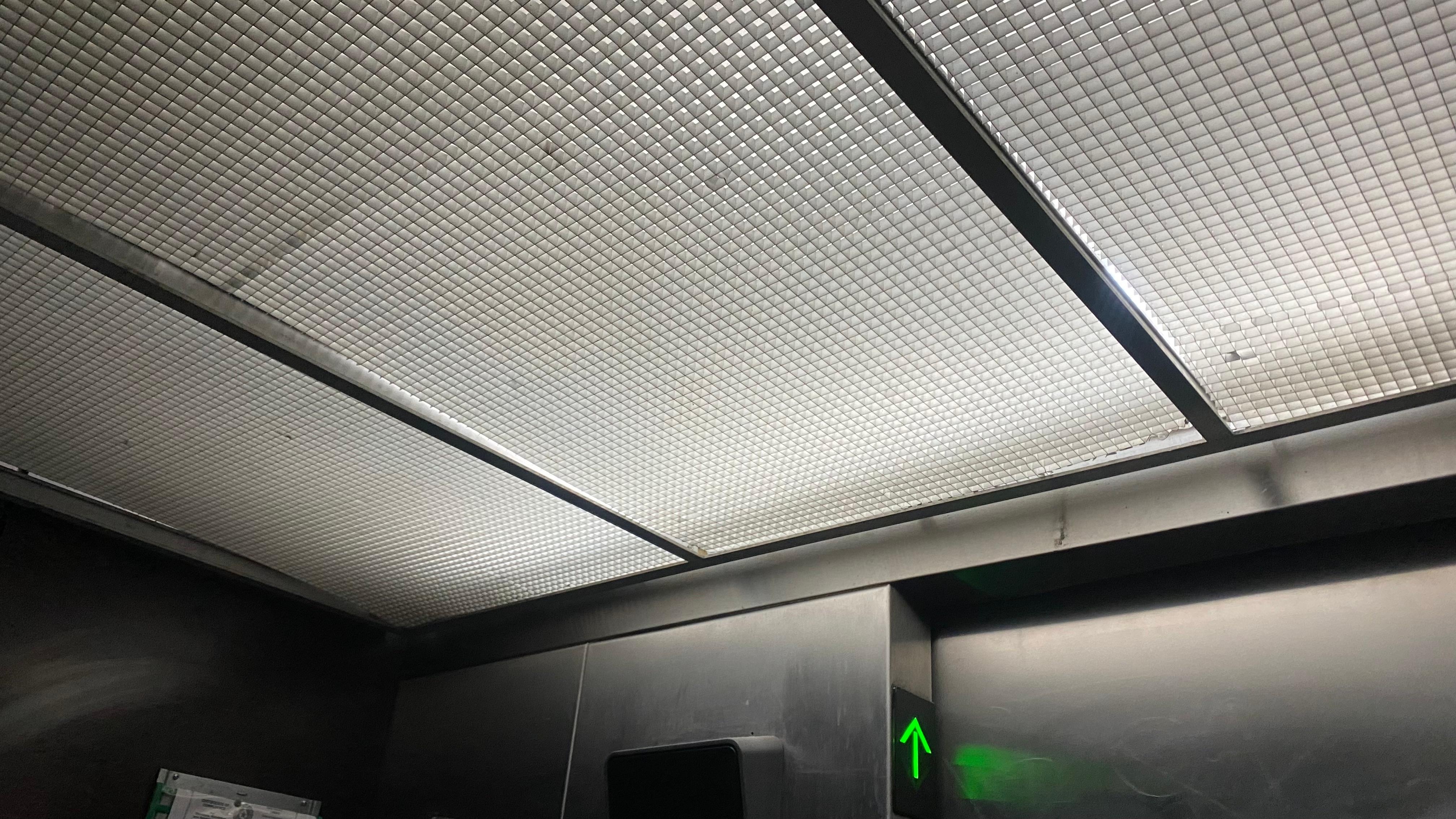 Elevator, poor lightning, smelled like urine.