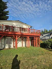 Pic facing house and deck from yard down below