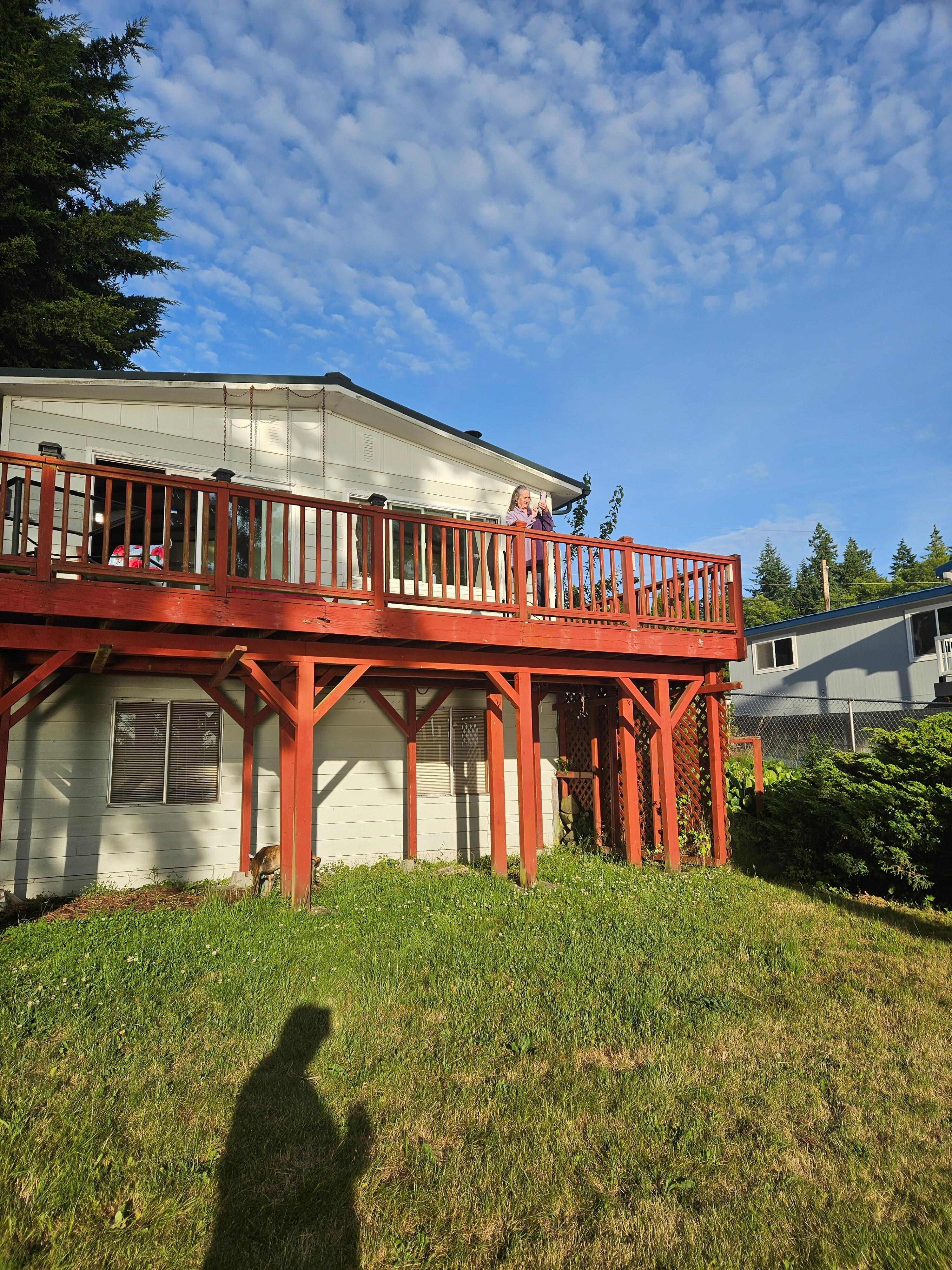 Pic facing house and deck from yard down below