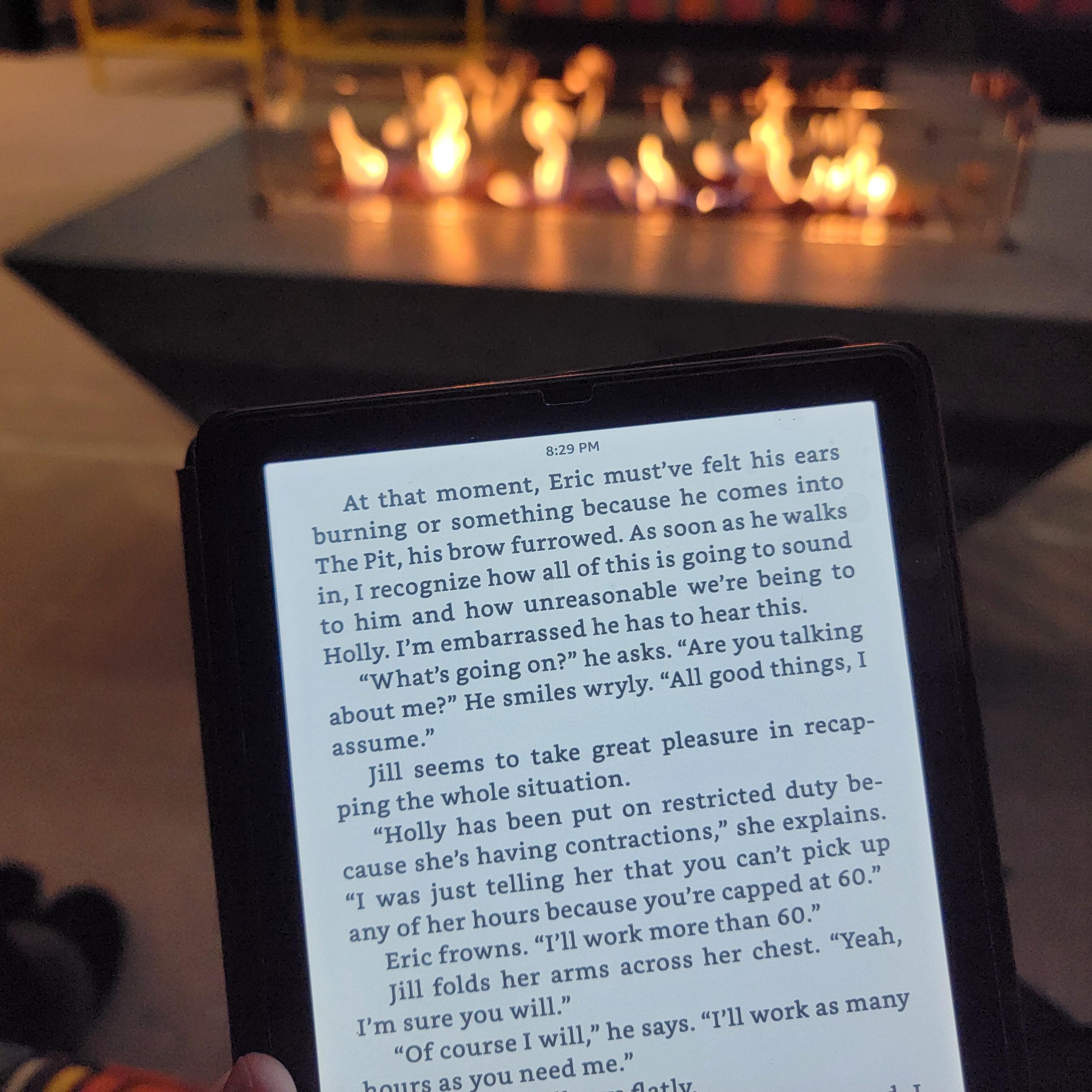 The receptionist lit the fire outside for some late night reading.