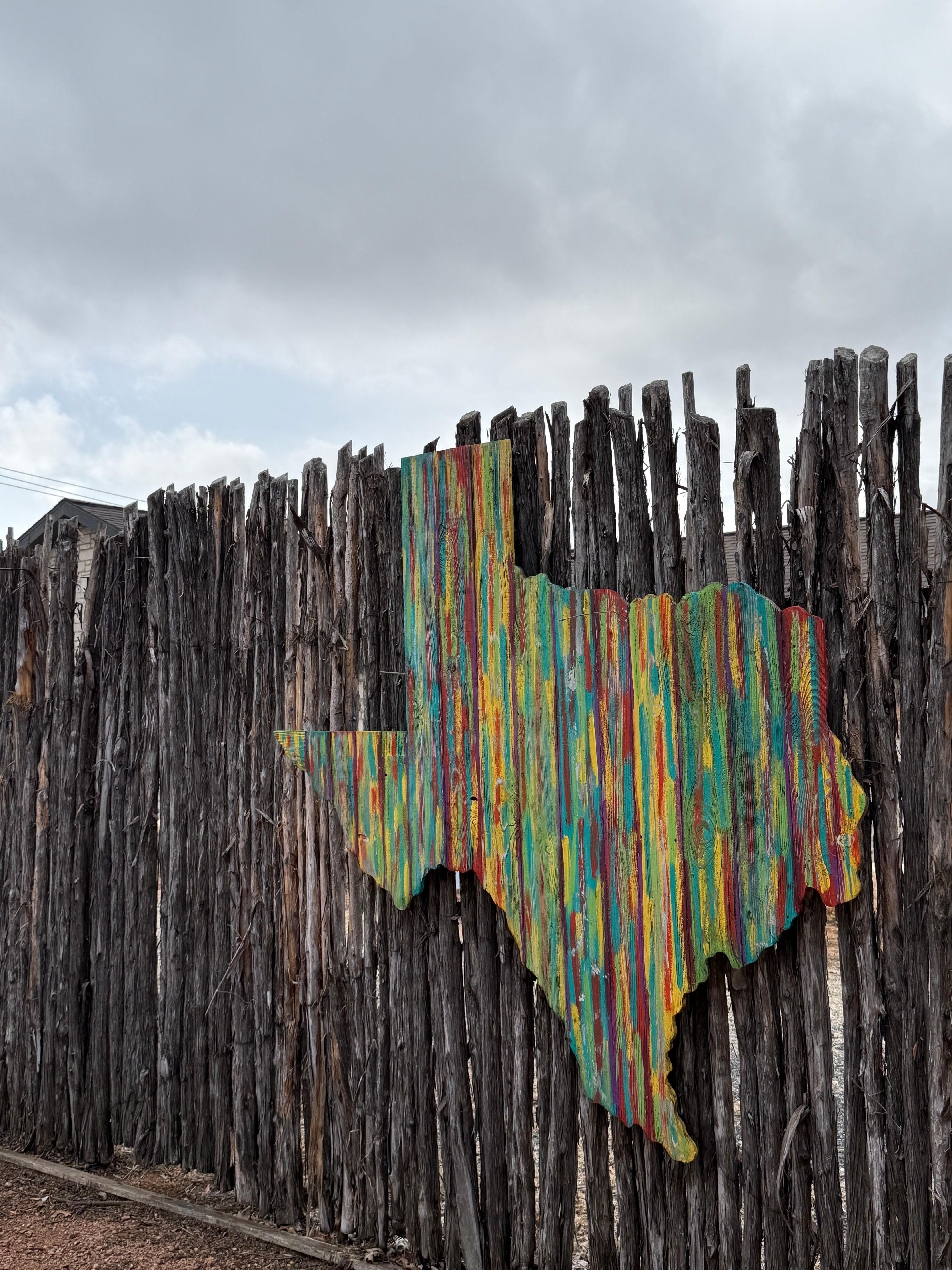 Art on the back fence near the firepit