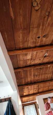 The host made every effort to preserve the original elements in the cabin. Look at the ceiling!