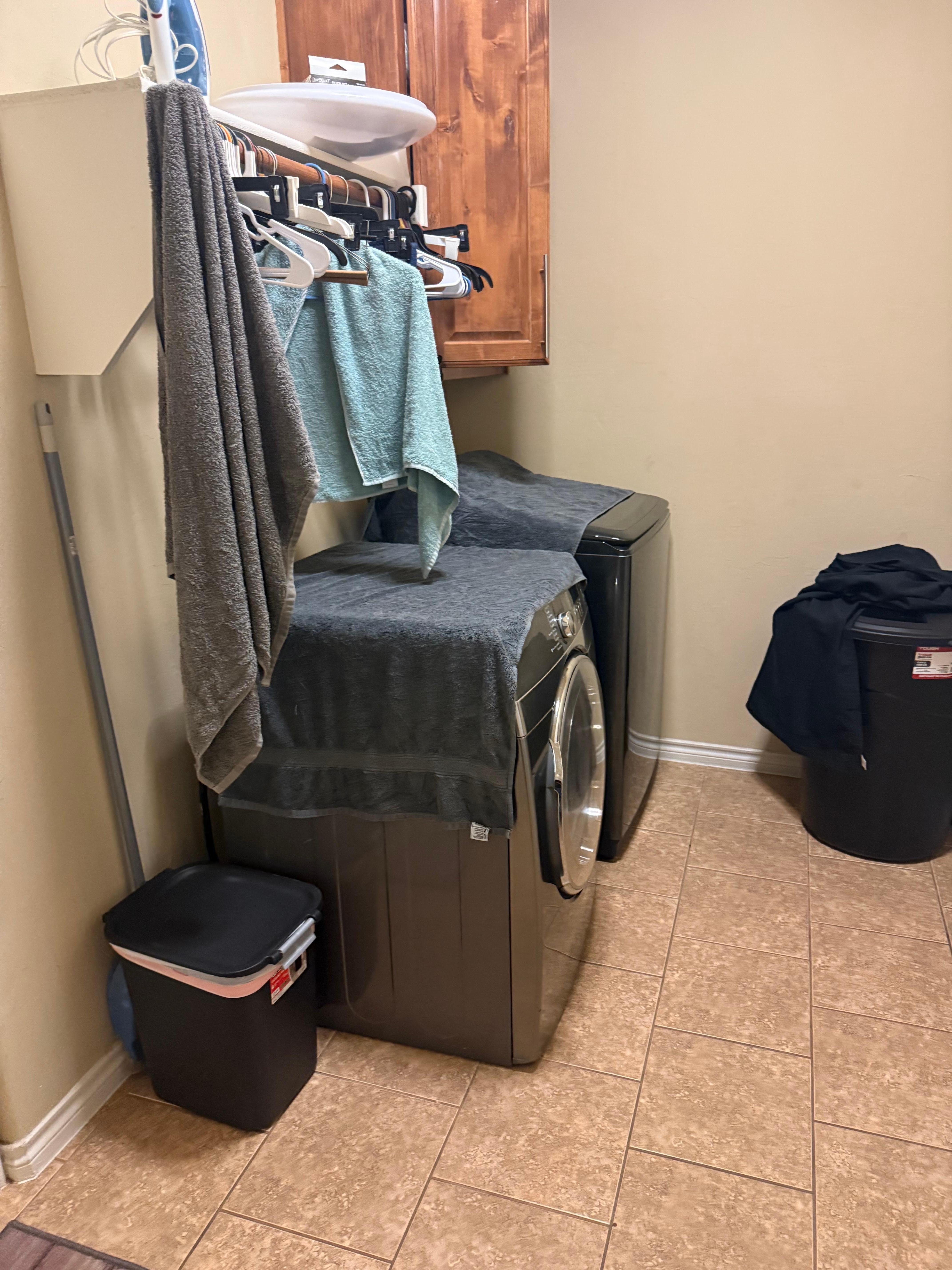 Towels on top of broken dryer