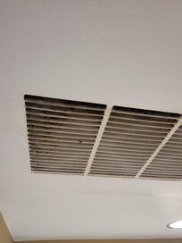 Dirty/rusty air vet above kitchen area