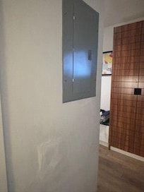 electrical panel and dent in the wall