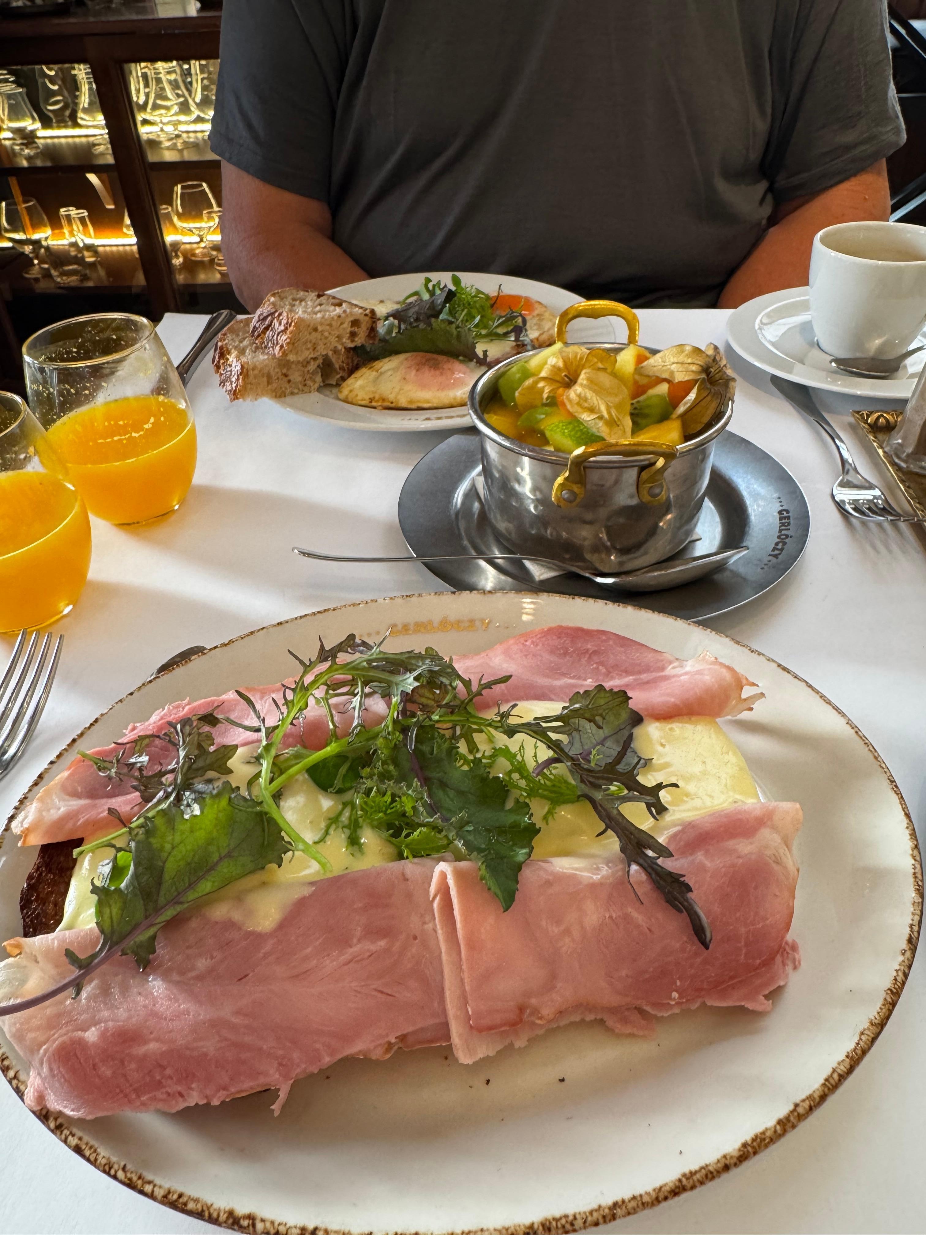 Eggs Benedict and fresh fruit salad. Get the breakfast add on!