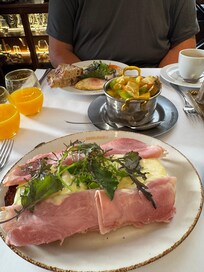 Eggs Benedict and fresh fruit salad. Get the breakfast add on!