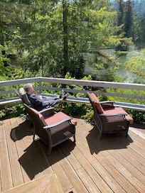 MIL relaxing on the deck overlooking the river