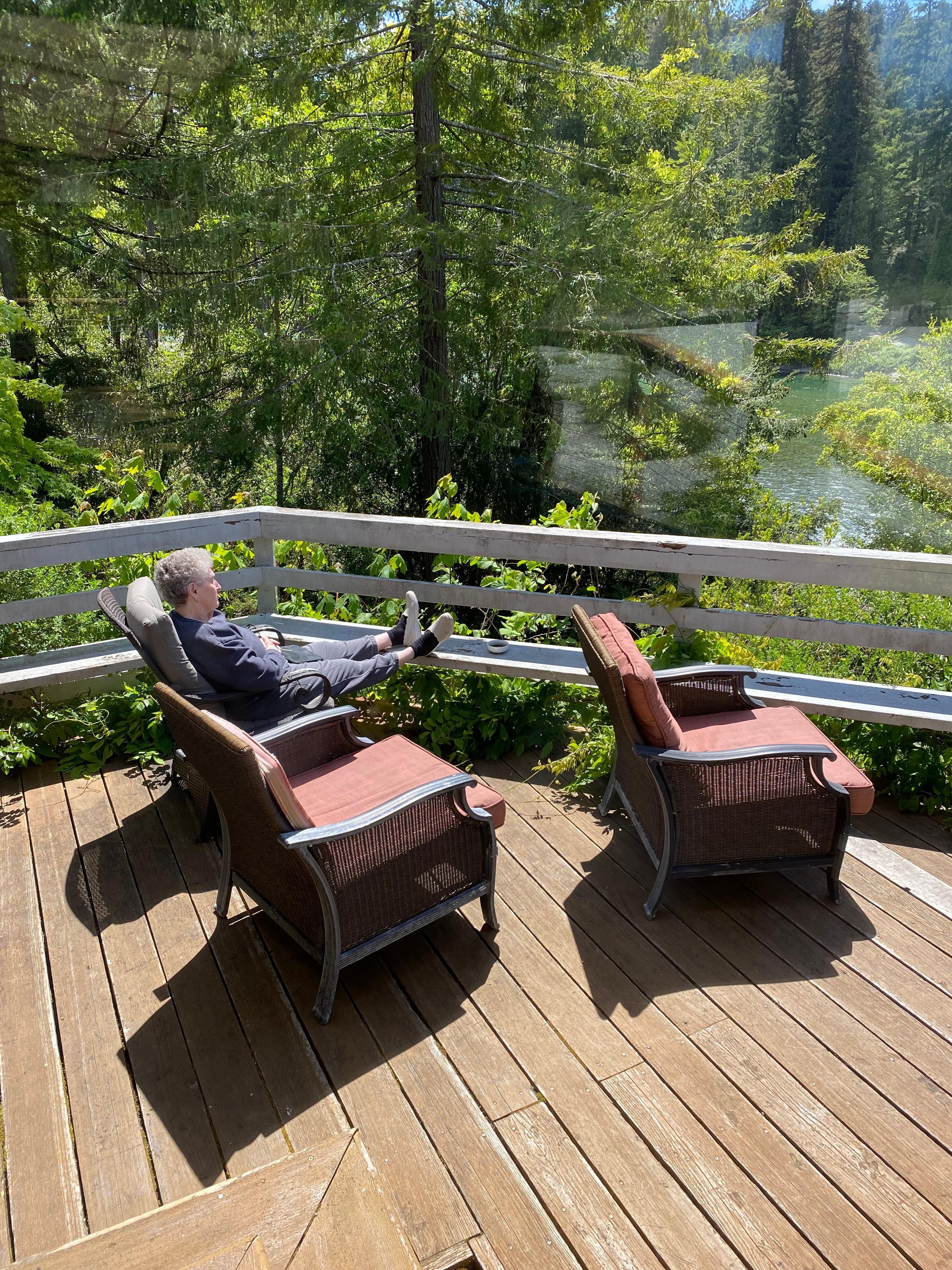MIL relaxing on the deck overlooking the river