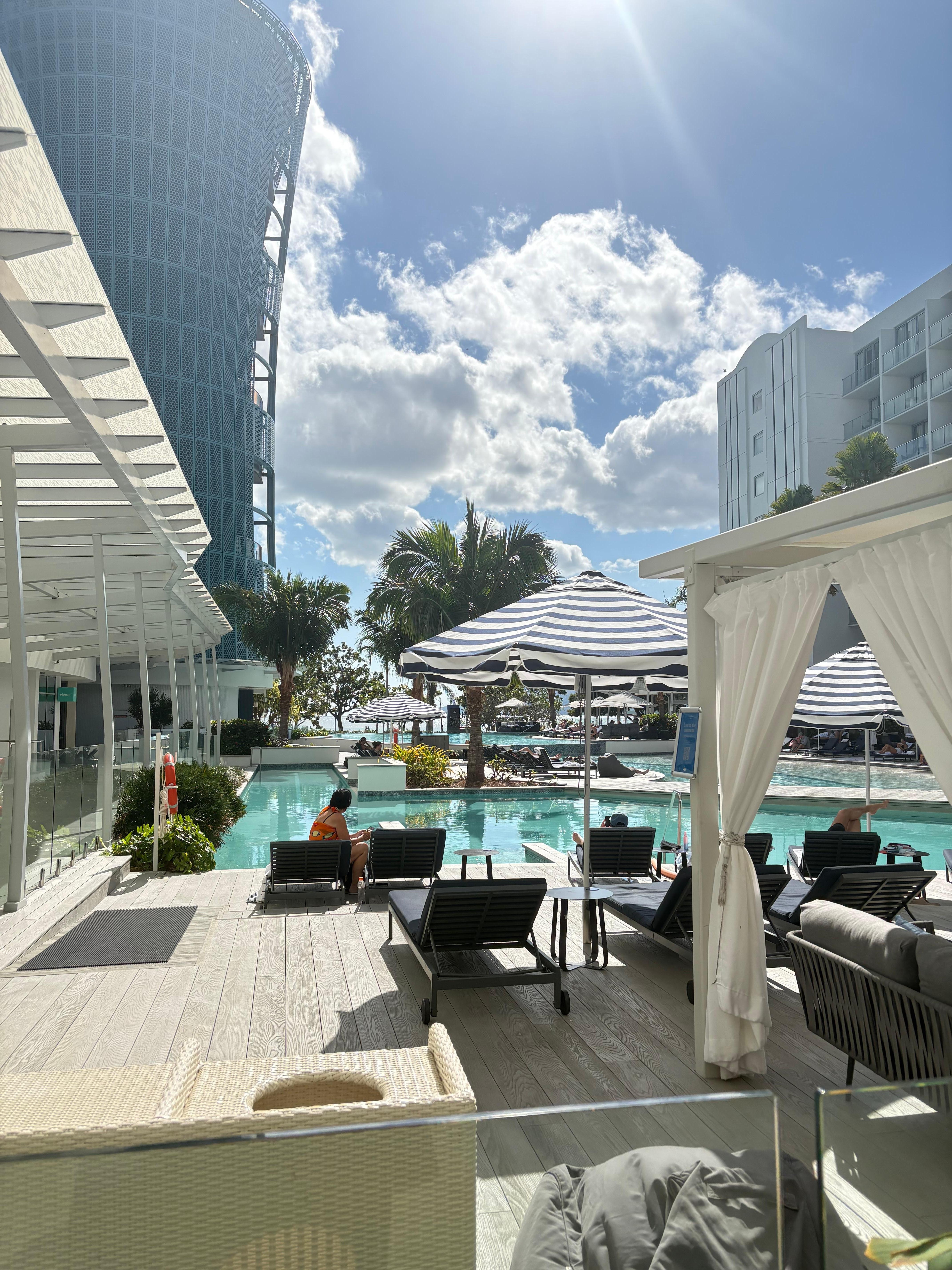The pool area with cabanas and plenty of lounge beds