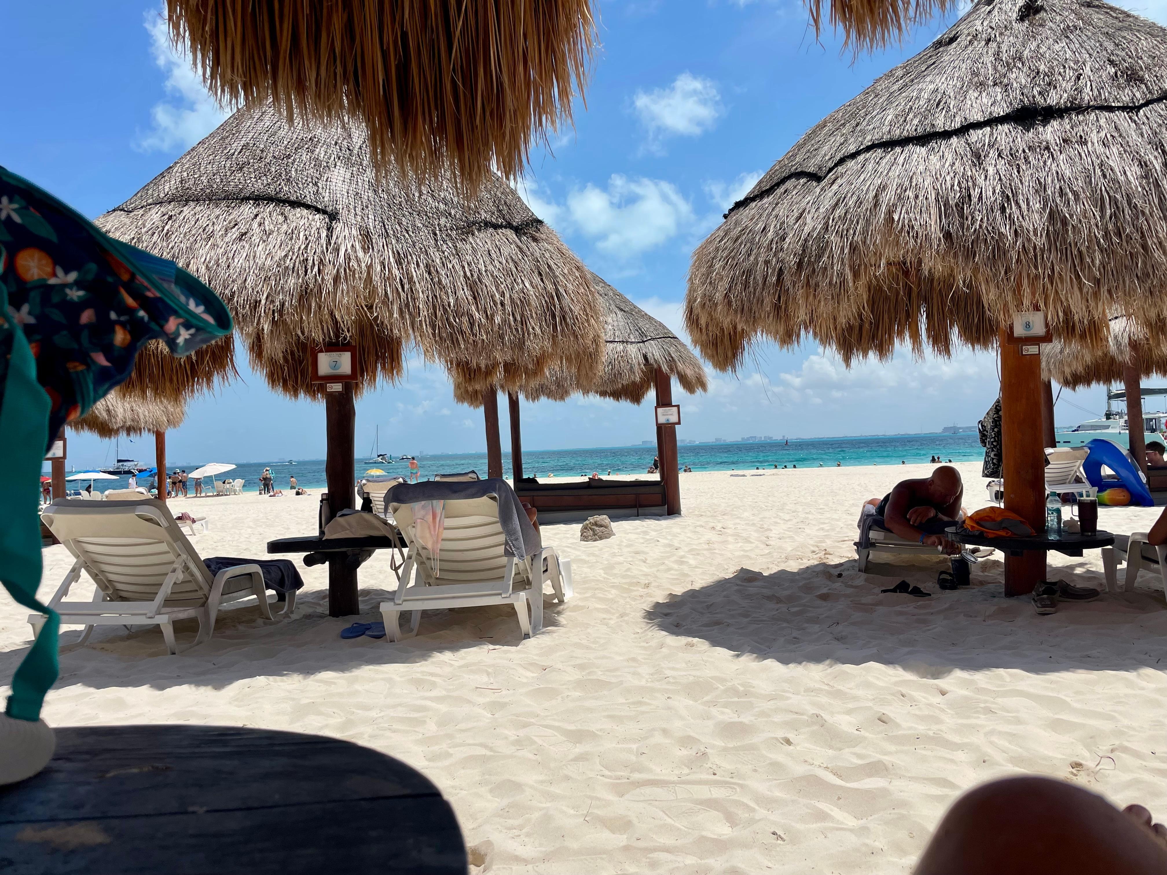 Resort beach area sipping drinks and eating fresh guacamole!