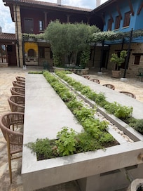 Table with herb garden & center stream fountain