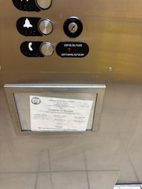 Elevator not inspected since 2022, it jumps and lurches, likely unsafe.