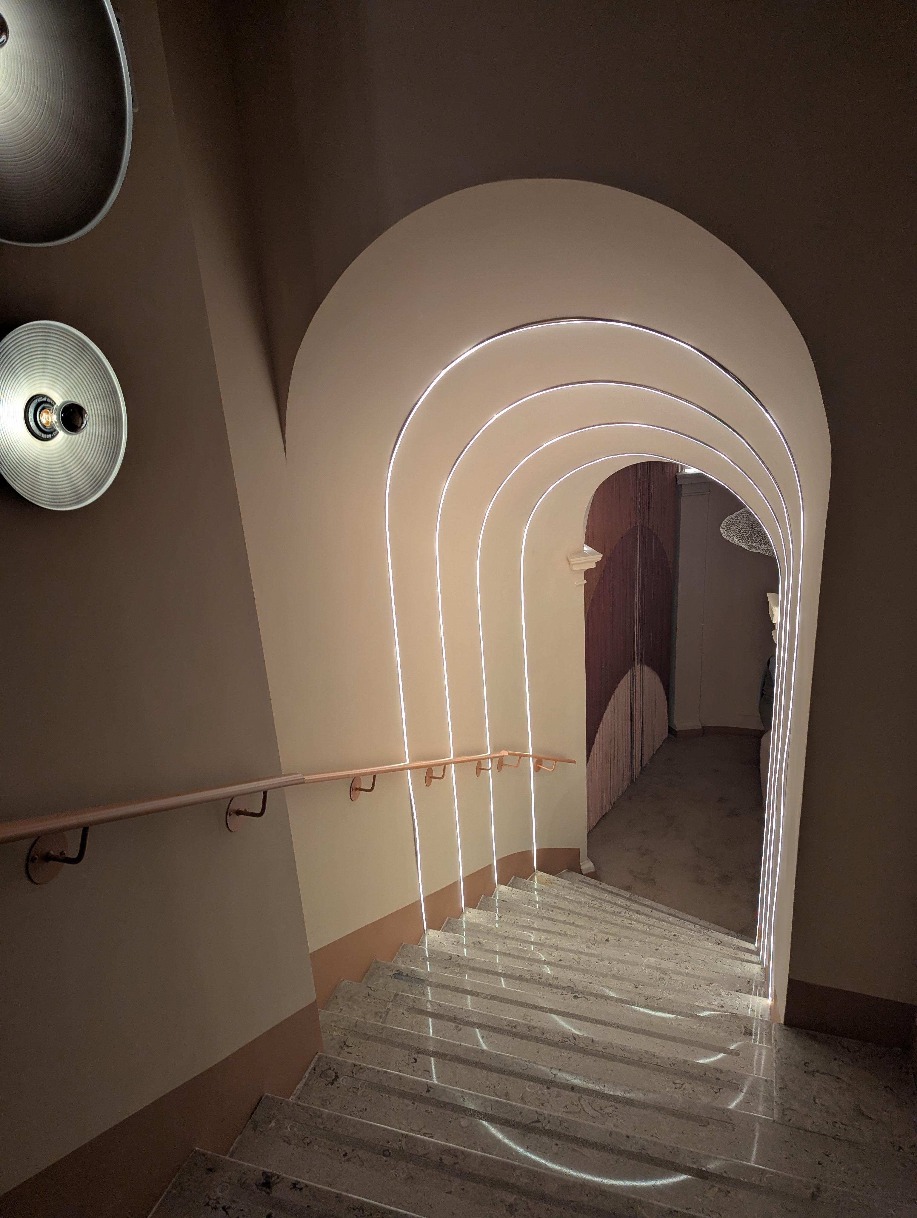 Stairs leads to front desk