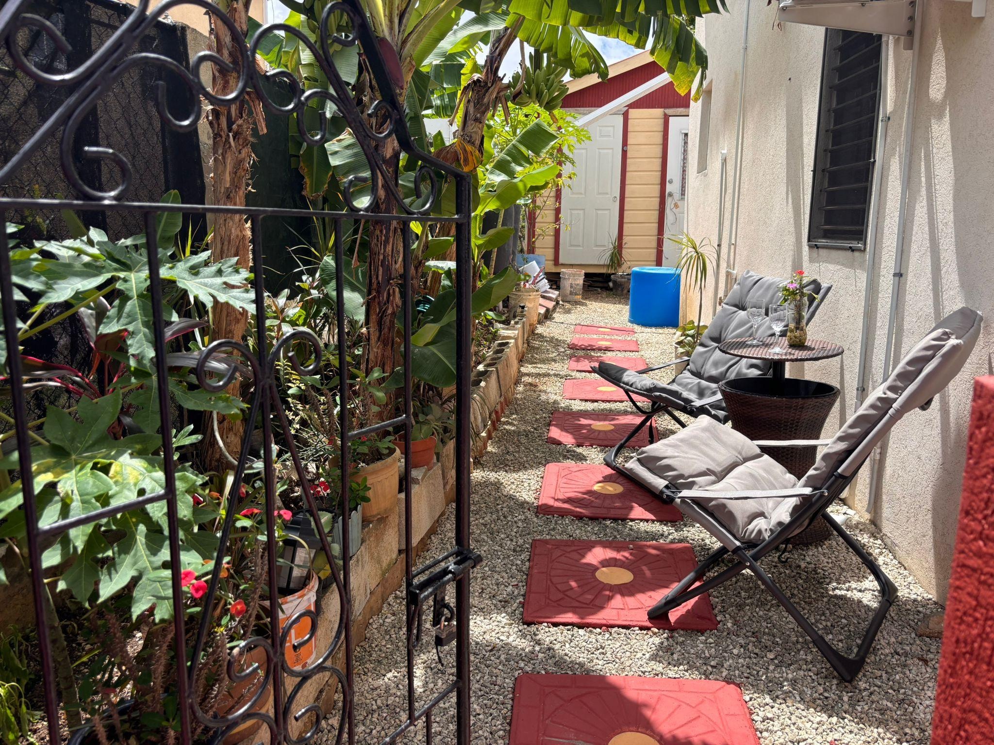 Seating with Banana trees and lovely planting