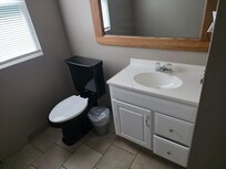 The trash can is the only thing not nailed down that's in that apartment.