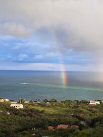 Catching a rainbow one morning from the house