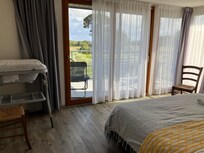 Bedroom with balcony and countryside views
