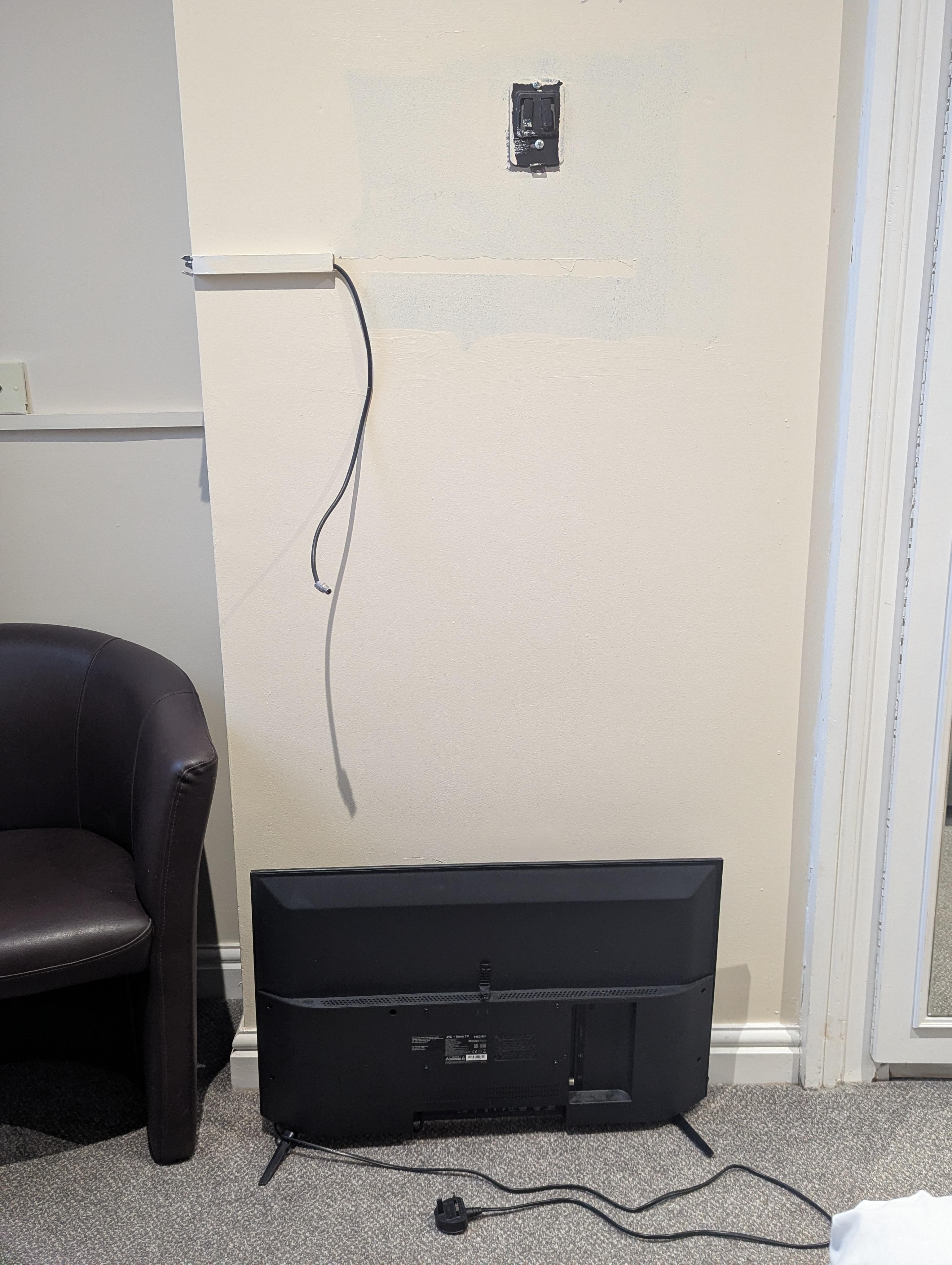 TV with uncovered wired