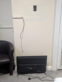 TV with uncovered wired