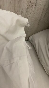 Threadbare and grey bedlinen