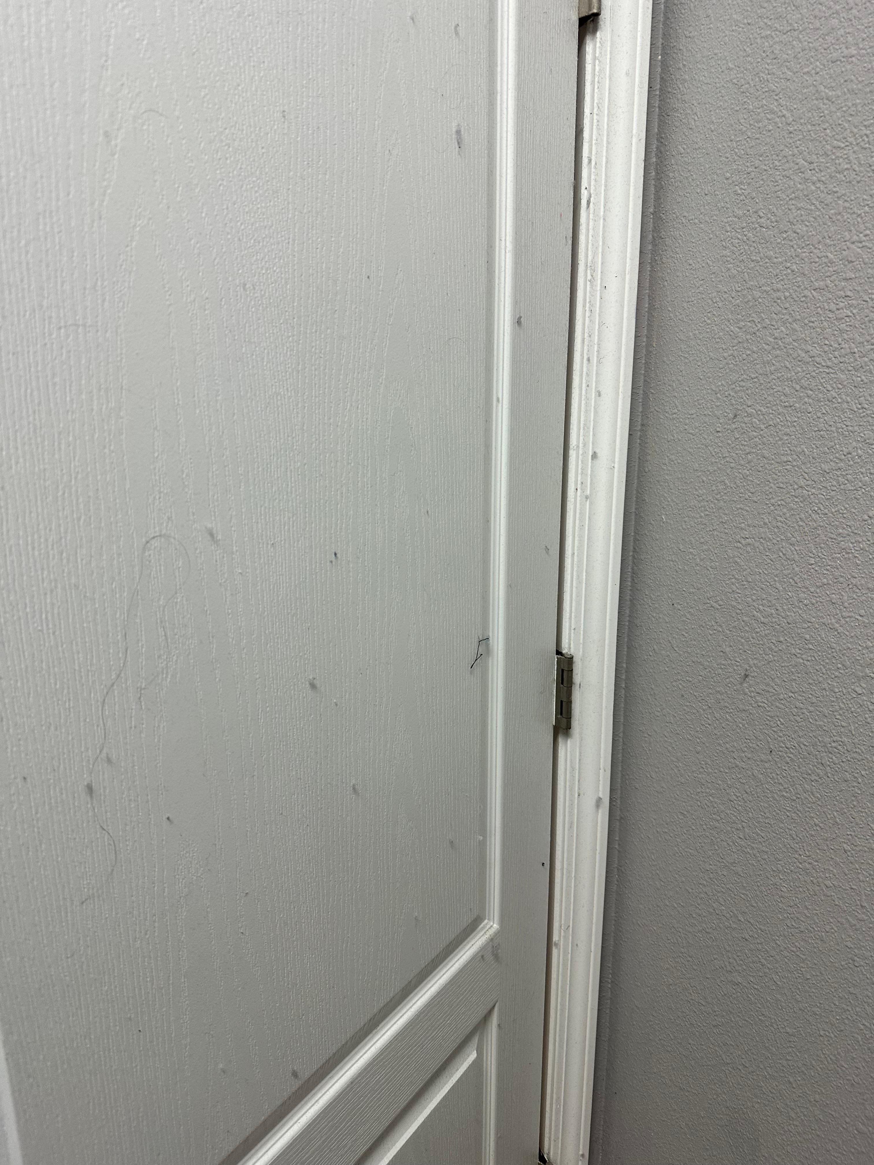 Lint on door and wall