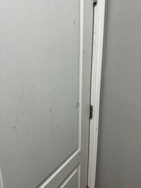 Lint on door and wall