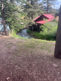 Side view of river and neighbors house