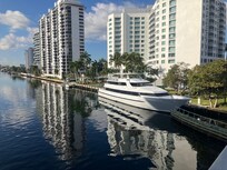Yacht moored outside hotel, image taken from bridge