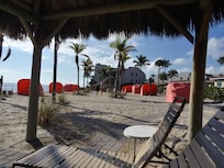 The private beach area is clean and inviting.