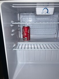 coke left in fridge by another guest
