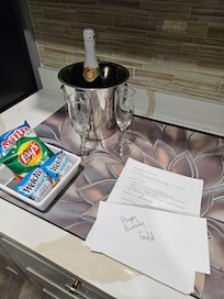 Surprise birthday letter, cider, and snacks!