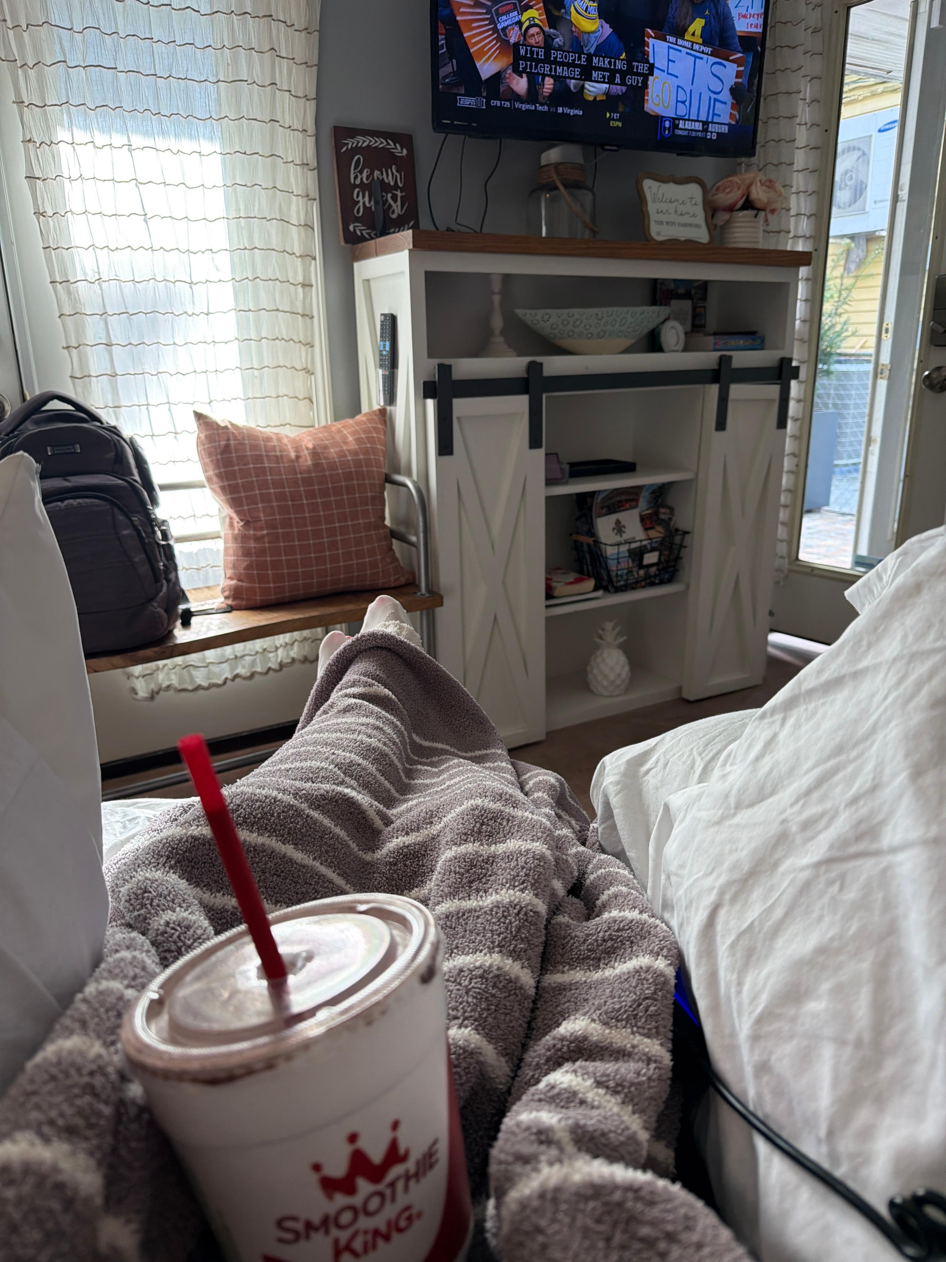 Watching College Football and enjoying a Smoothie King that was just a couple of blocks down the street!