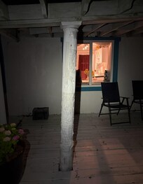 Rotted post that has been painted and taped
