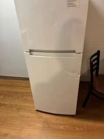 Dent in refrigerator when I checked in