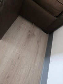 Dirty floor that was never swept or mopped.