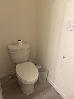 Toilet paper holder missing off the wall.