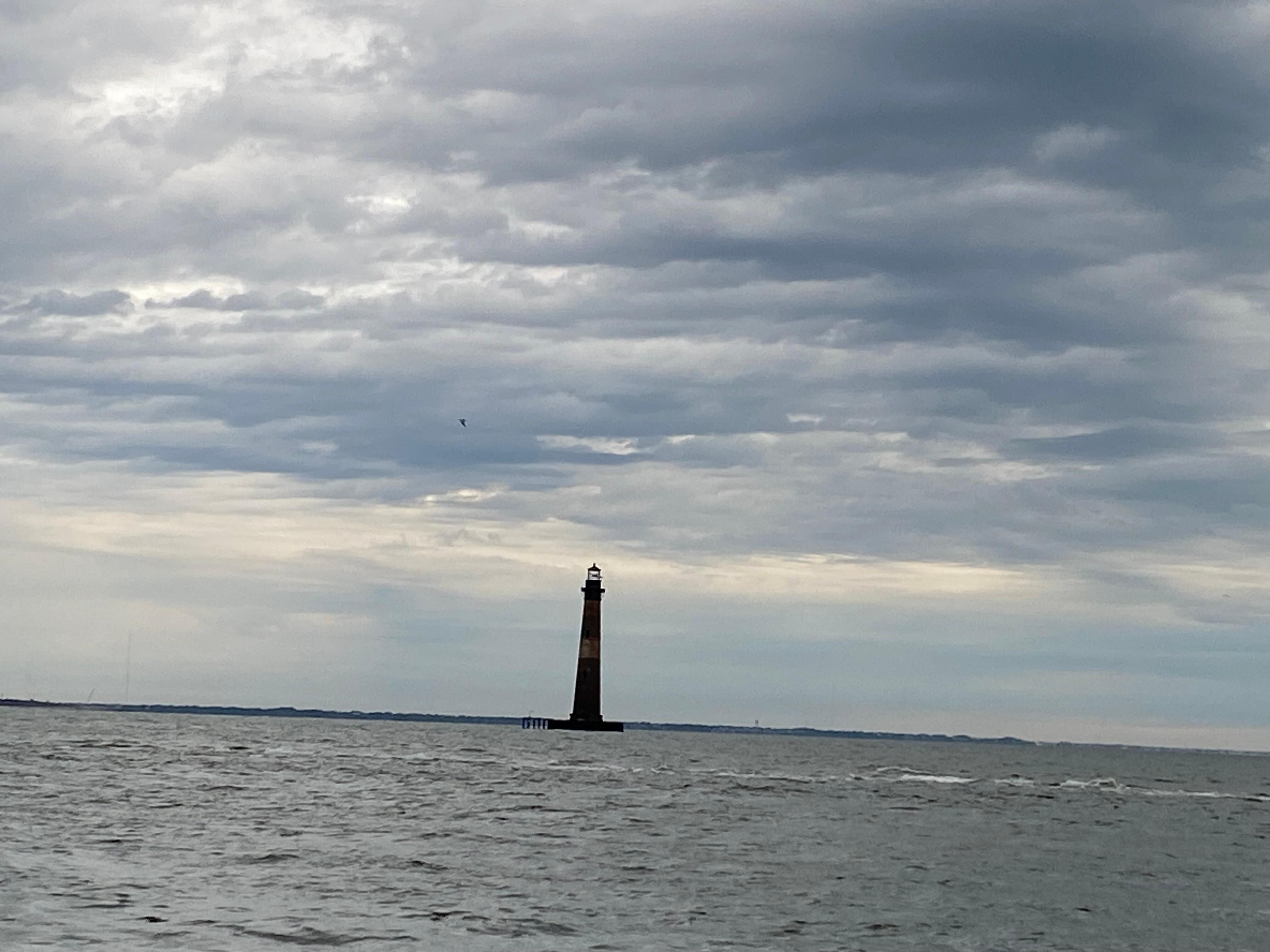 Lighthouse view where the skyline meets the ocean