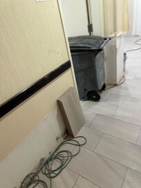 Contractors equipment in the hall outside breakfast room