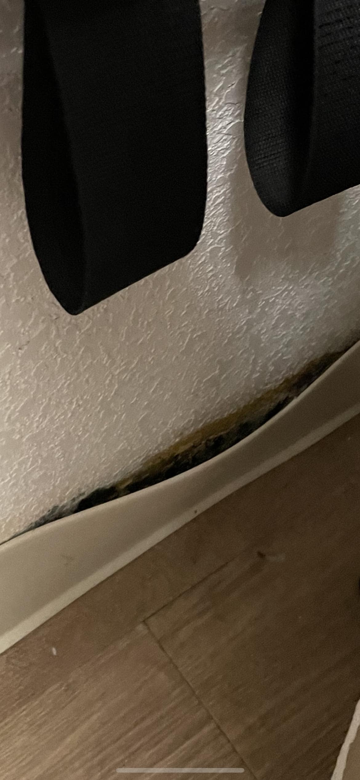 more baseboard mold, ironing board was standing up in front of this area