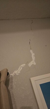 Wall crack partially repaired.