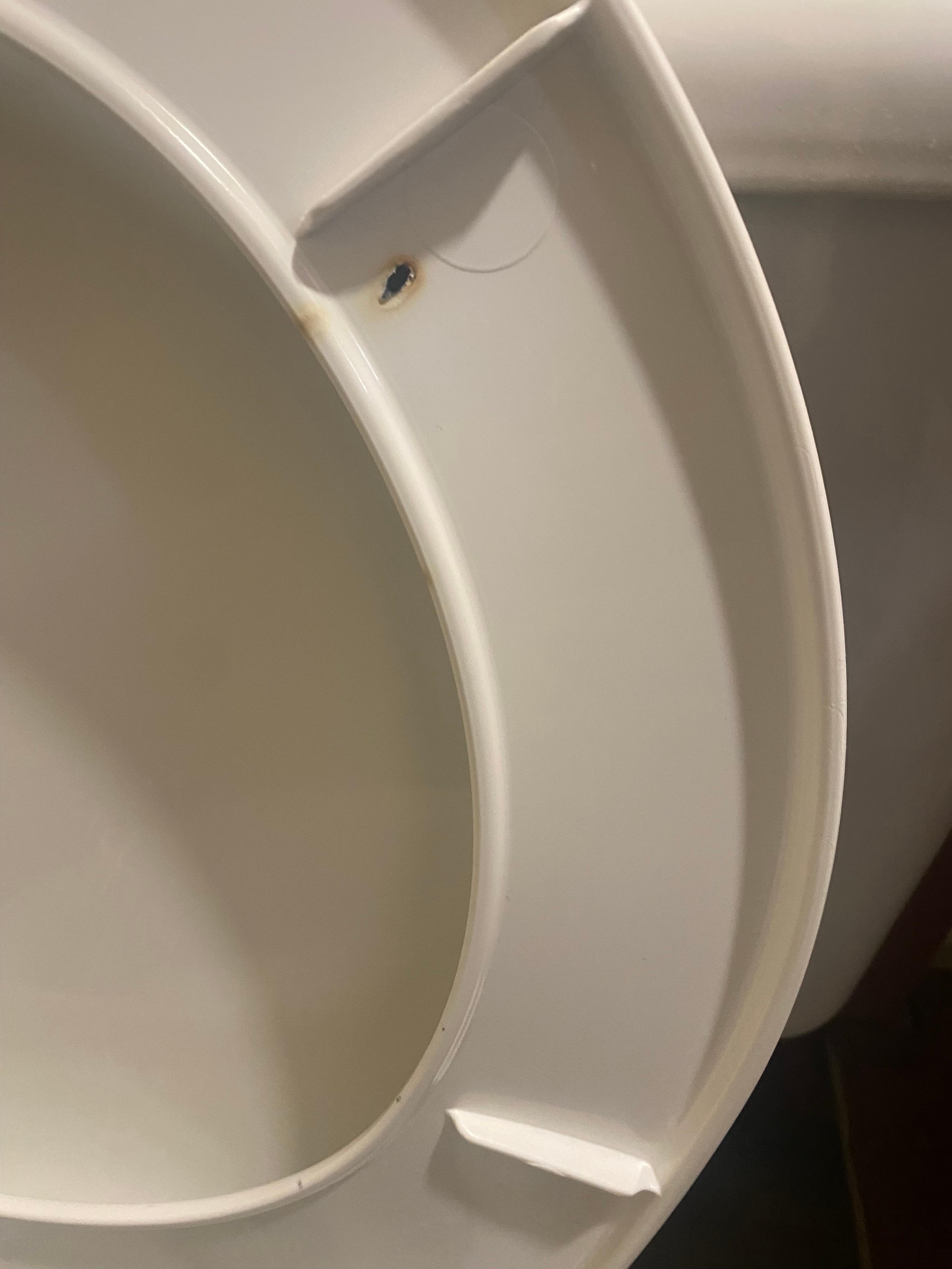 Burn marks underneath toilet seat