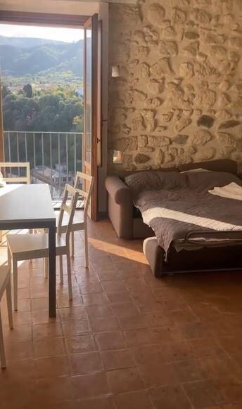 Downstairs when you first enter. We moved the sofa bed under the TV