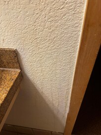 Dirty walls in bathroom.