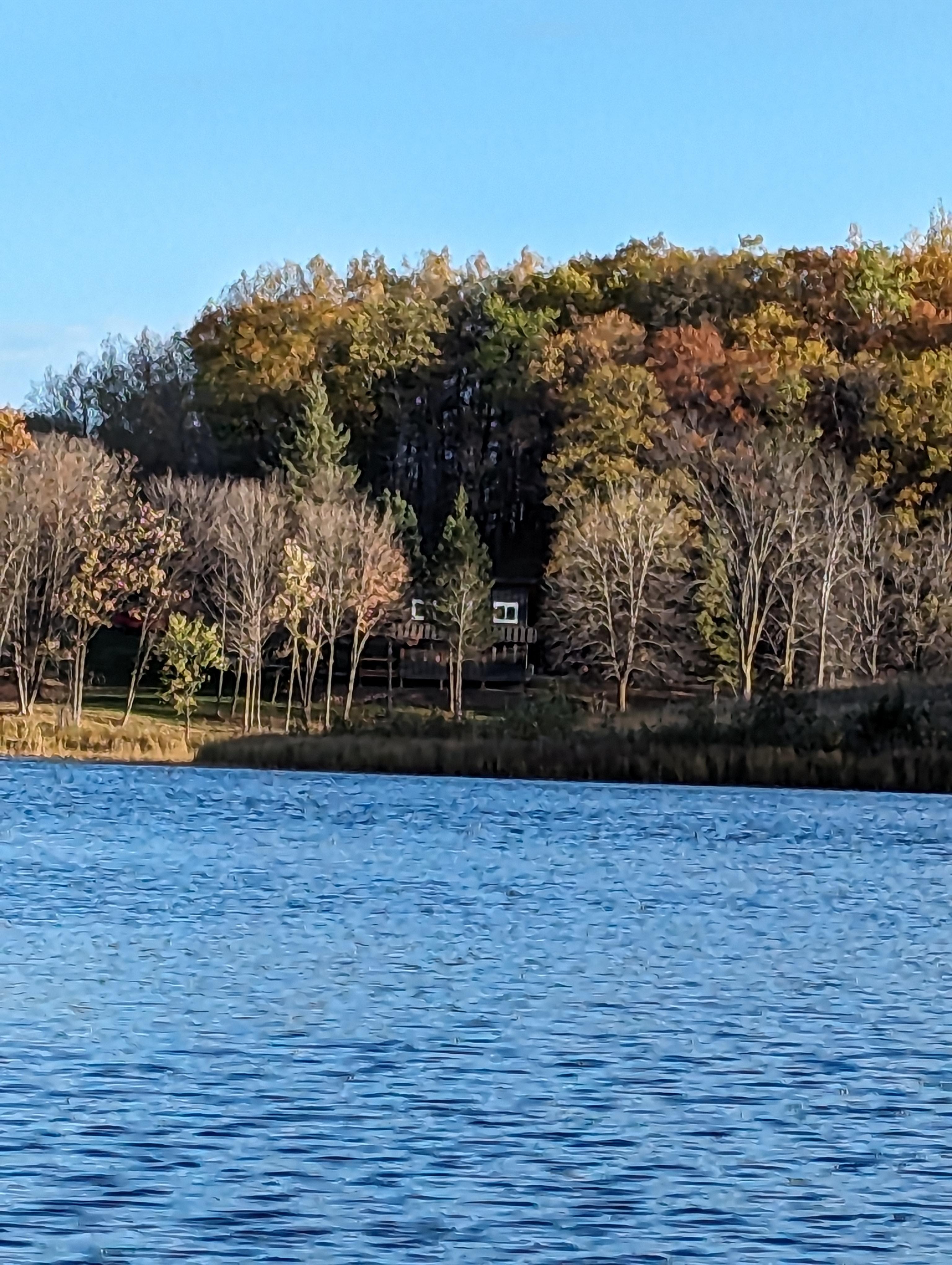 looking at the cabin from across the lake