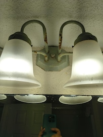 Bathroom light had green stuff and rusty